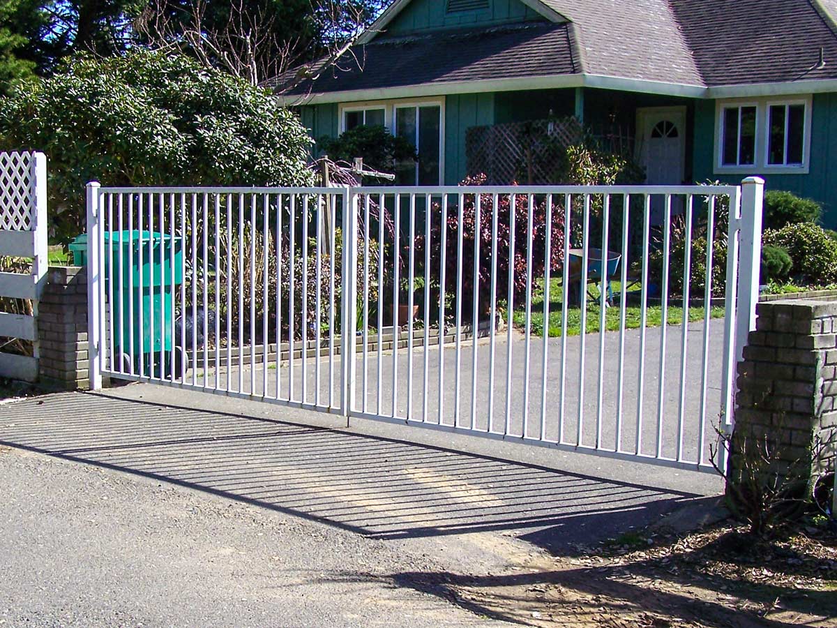 DiFranco Gate & Fence - Residential & Commercial Custom Automated Gate Contractor - Ornamental Iron - Western Style double swing steel frame with a white paint finish automatic gate - Sonoma County CA