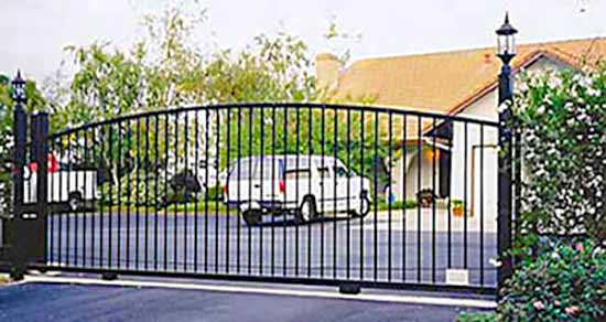 DiFranco Gate & Fence Company - Custom Ornamental Iron Driveway Gates - Simple Arched - 2-Panel Western Design Driveway Gate with Lamp Post - Petaluma, CA